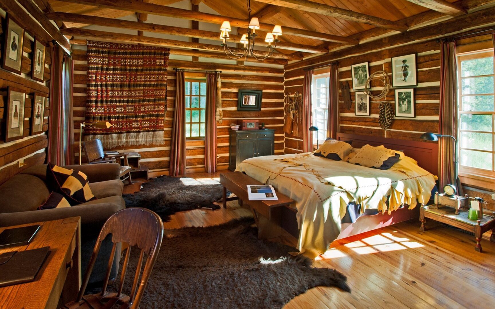 A cozy log cabin with a rustic bedroom.