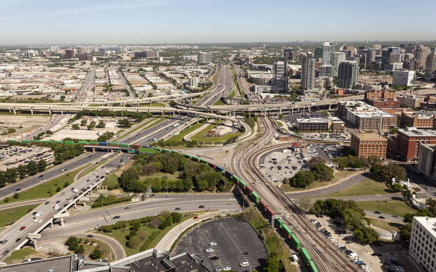An aerial view of a city with highways, buildings, and Single Family Homes for Sale in Dallas Texas.