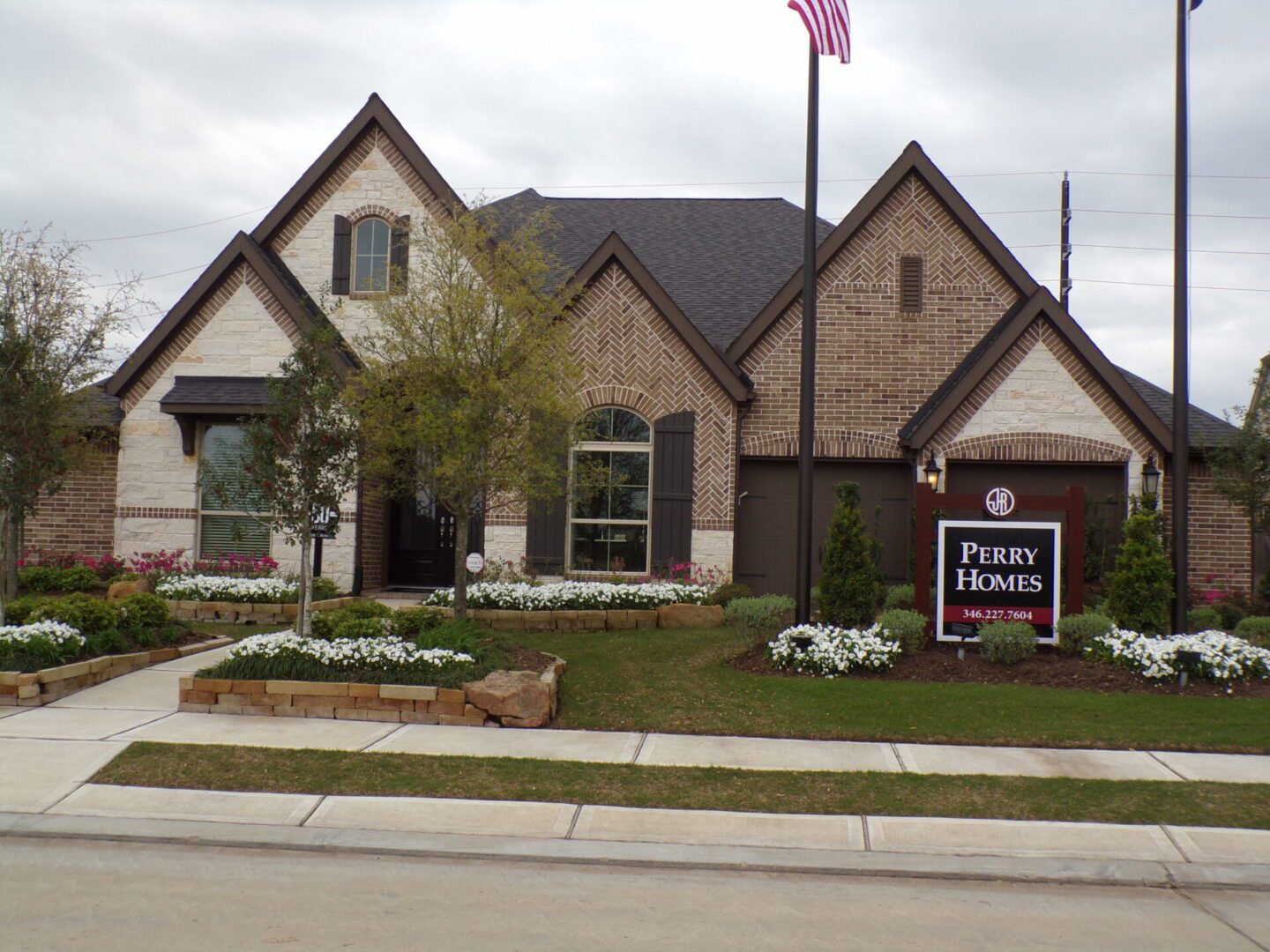 A Texas house with a sign in front of it, built by builders.