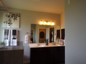 Texas builders have constructed a bathroom with two sinks and a mirror.