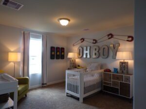 A baby boy's room with a crib and a lamp built by Texas builders.