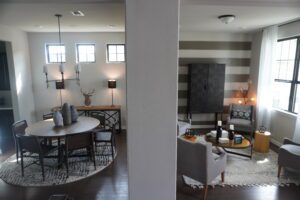 A view of a living room and dining room designed and built by Texas builders.