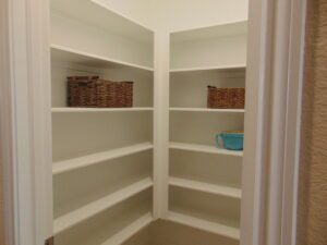 A closet with shelves and baskets in it, built by Texas builders.