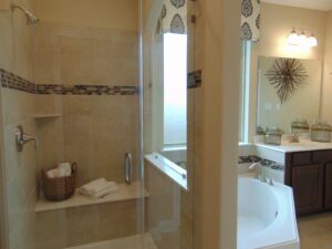 A bathroom with a tub and shower built by Texas builders.