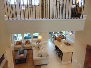 An aerial view of a living room and dining room constructed by Texas builders.