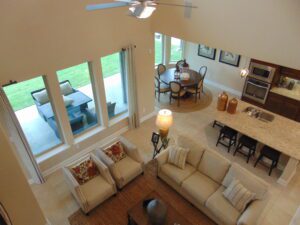 An aerial view of a living room and dining room designed by Texas builders.