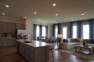 Modern kitchen and living room interior.