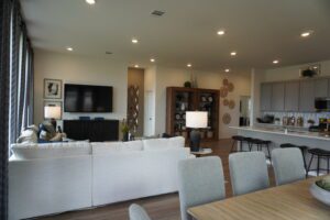 Living room with white couch and tv.